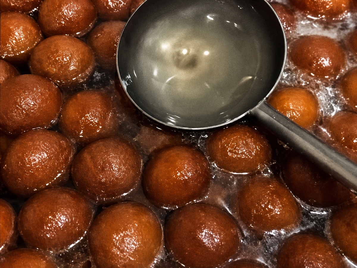 Gulab jamun resting in warm syrup